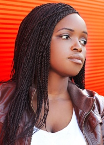 Portrait beautiful african woman wearing a leather jacket in cit